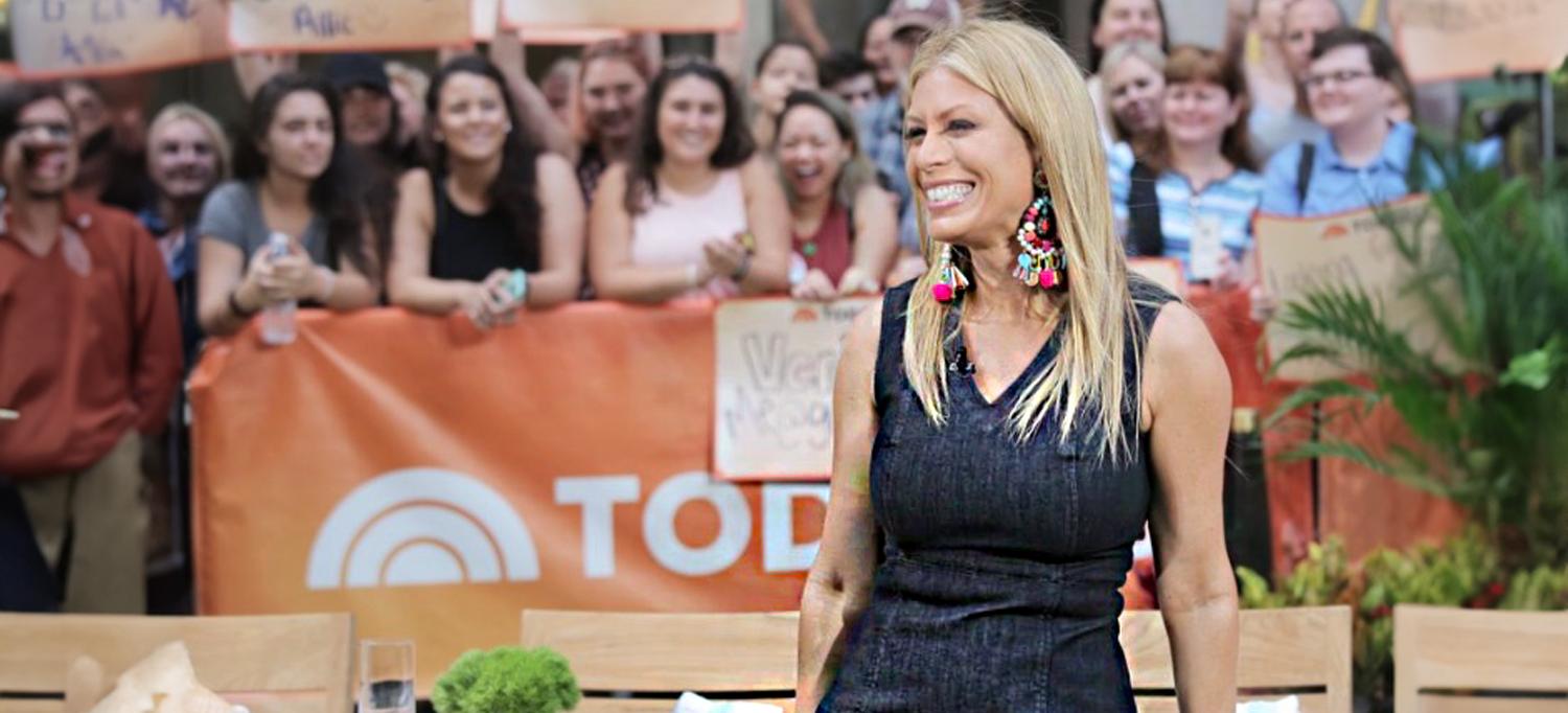 Jill Martin smiling in front of a Today show banner and a crowd outdoors