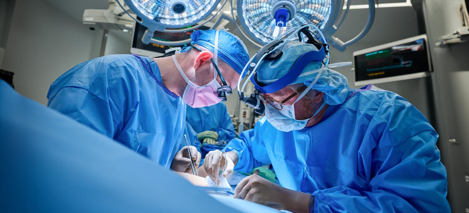 Dr. Robert Montgomery and team performing surgery in operating room