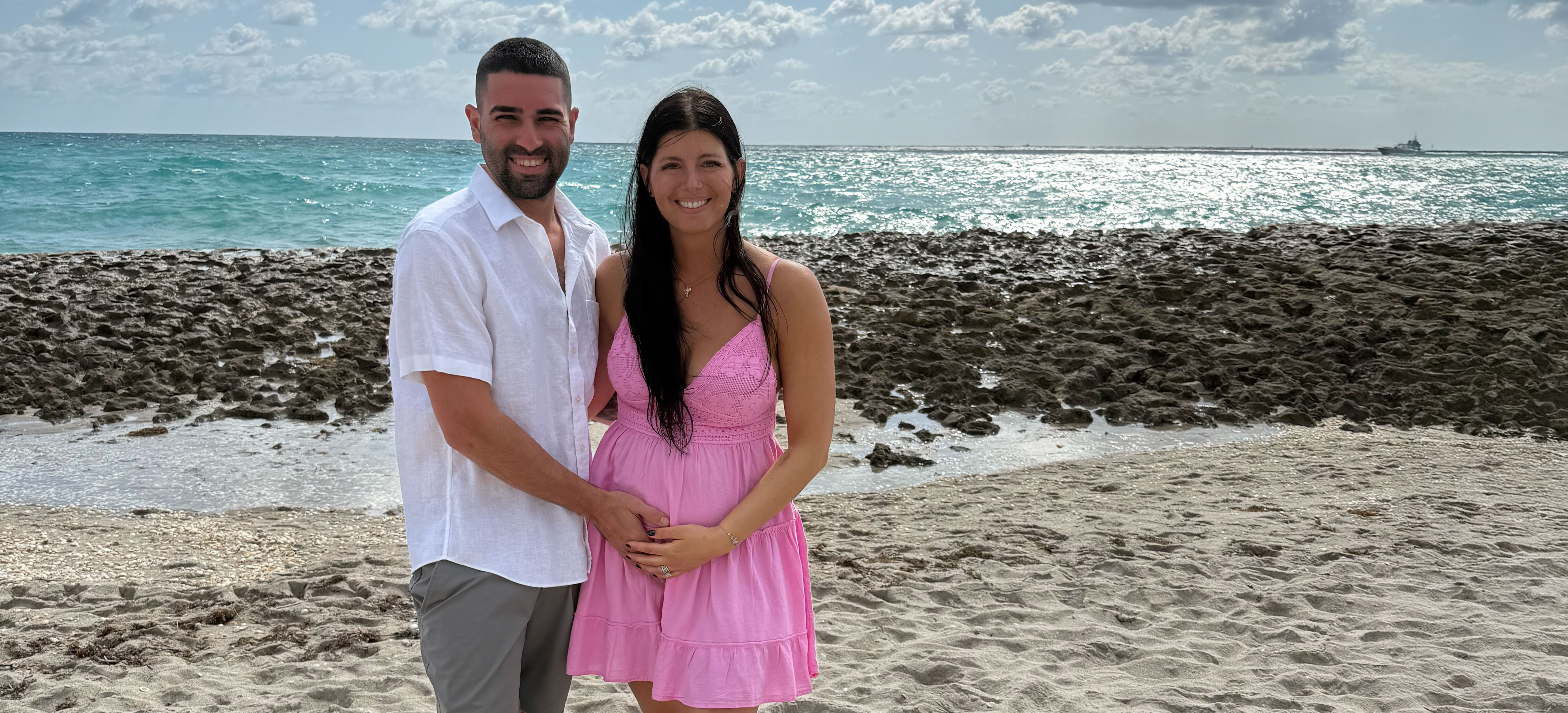 Dr. Shilpi Mehta-Lee speaking with a patient in an exam room.