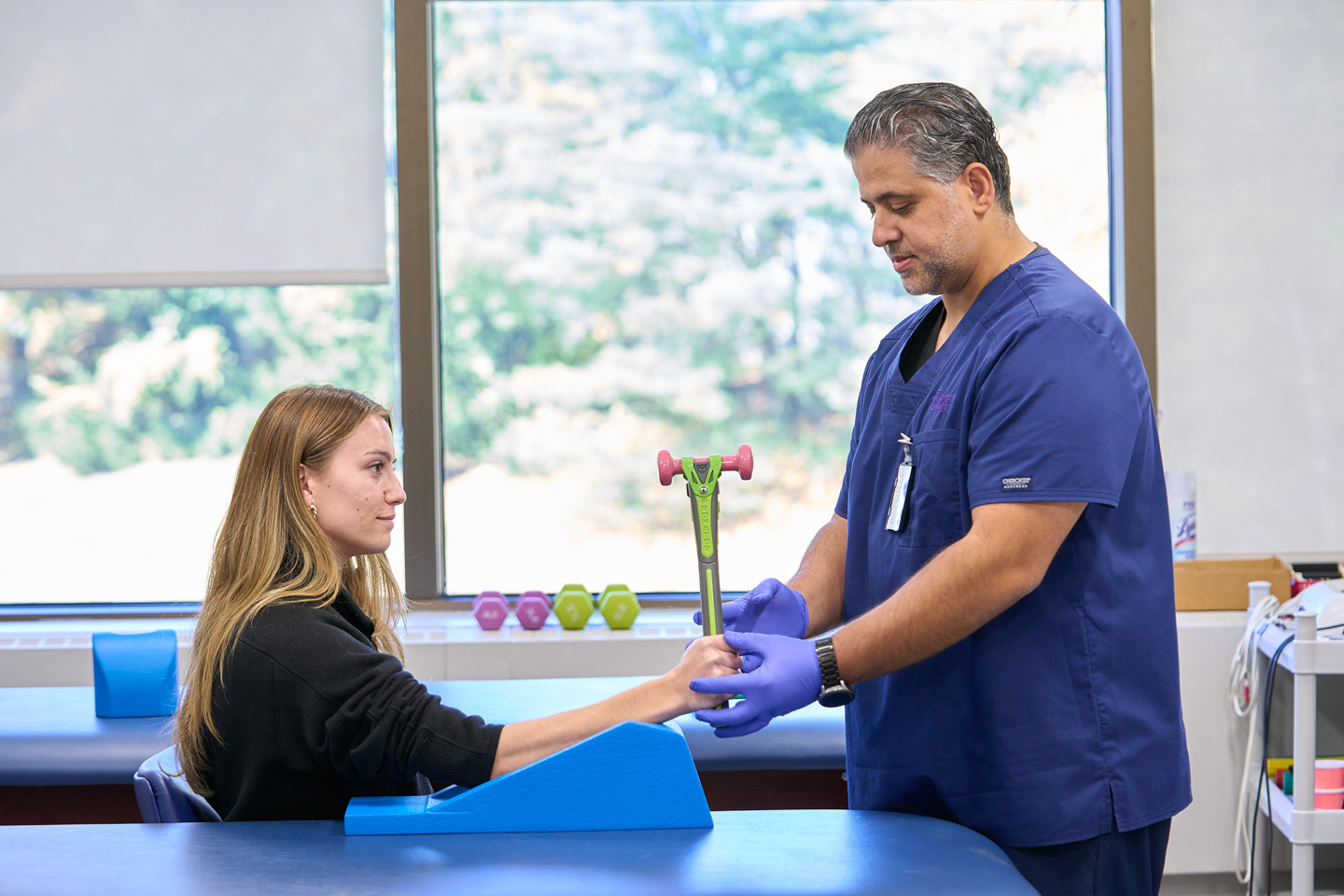 Occupational therapist Nesar Rabadi provides hand therapy to a patient.