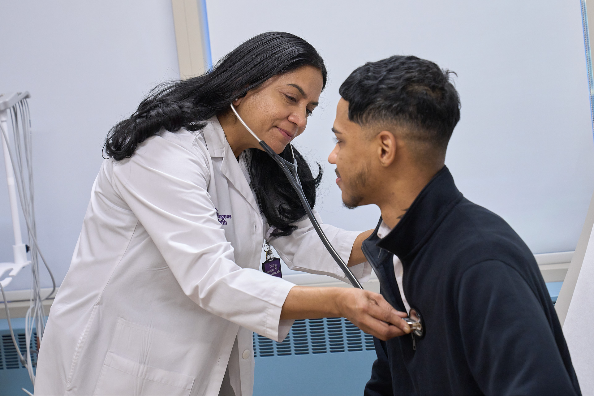 A doctor examines a patient.