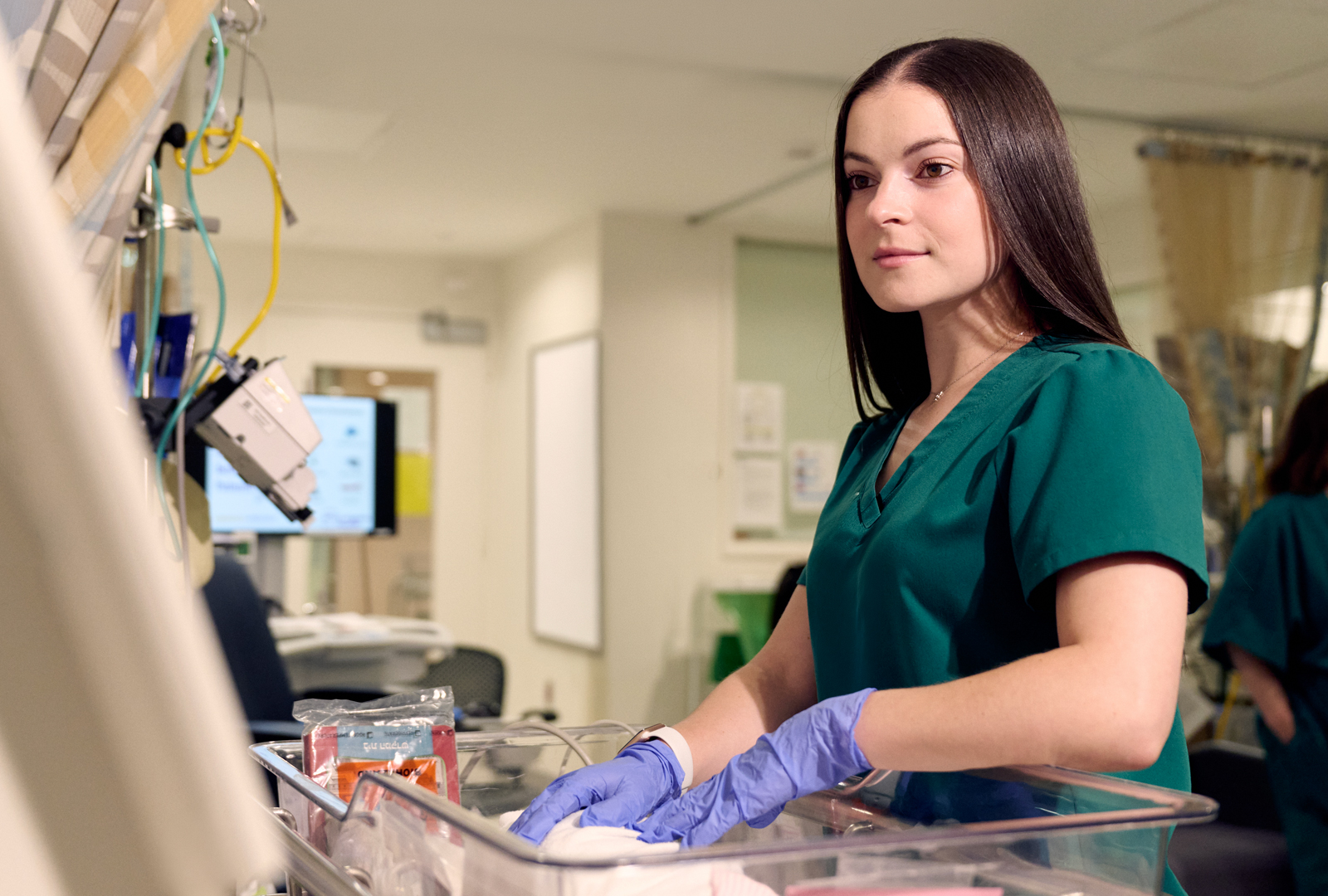A provider looks at a monitor.