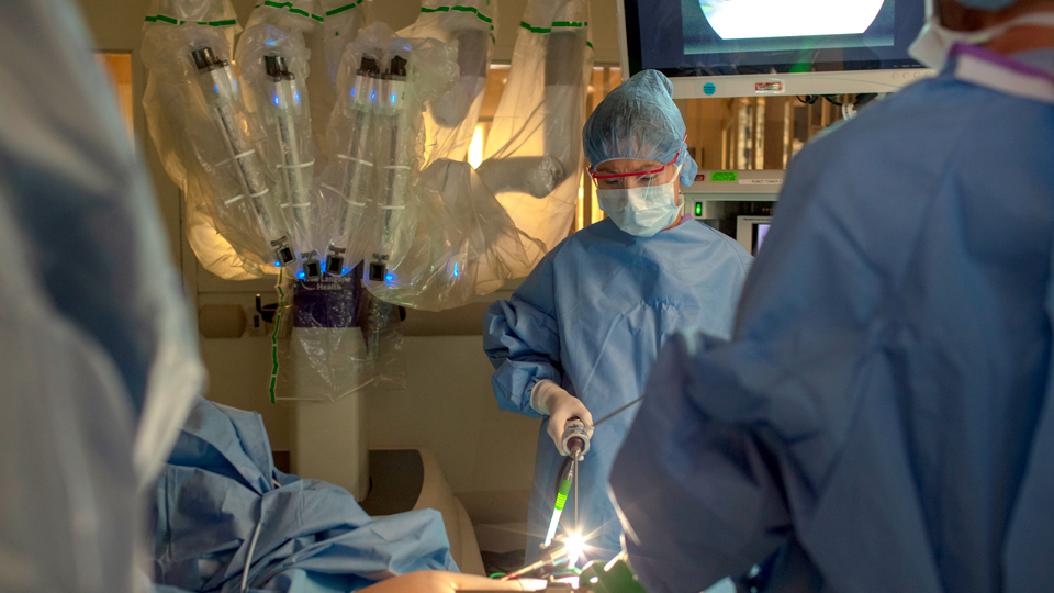 Surgeon Using Robotic Tools in Operating Room