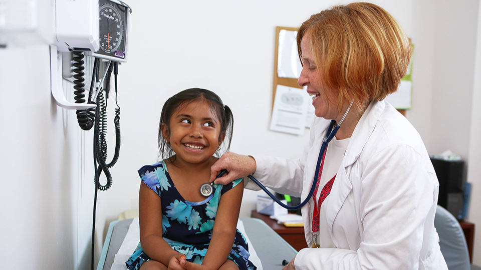 Doctor with Pediatric Patient