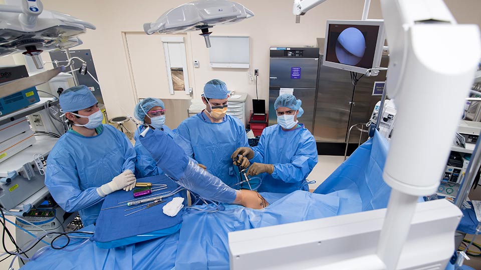 Orthopedic Surgeons Performing Surgery