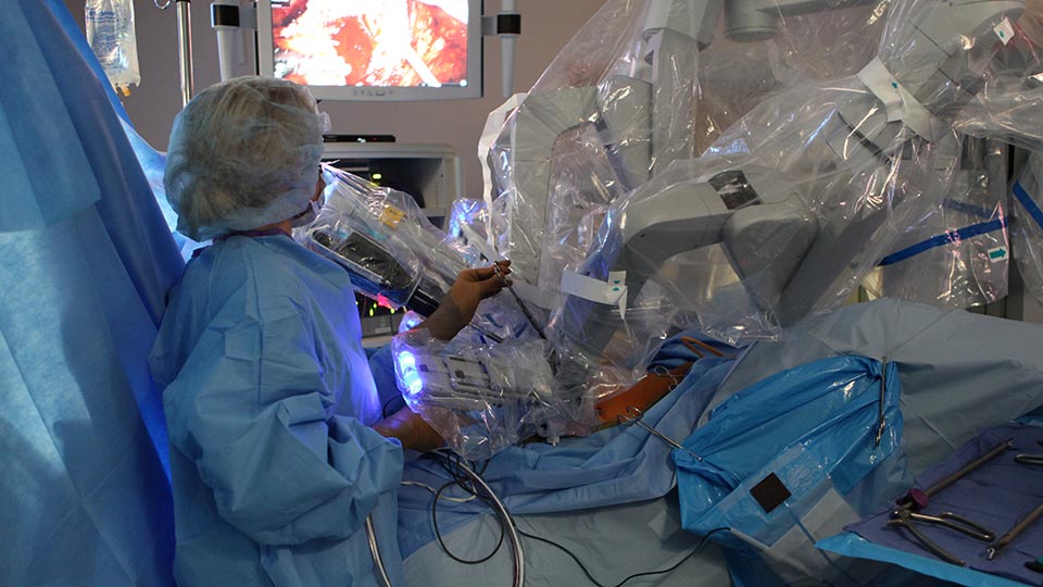 Specialist Uses Robotic Surgery Equipment