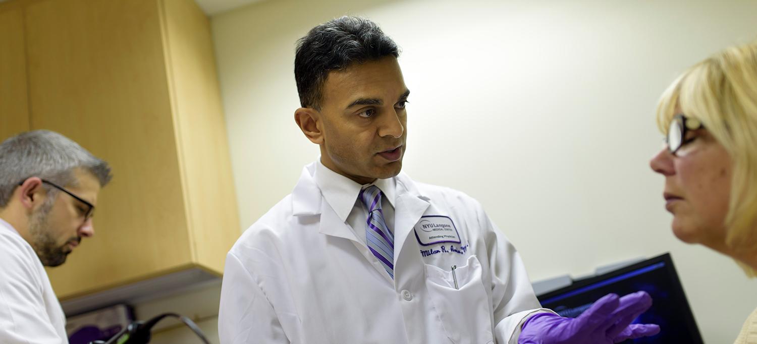 Dr. Milan Amin and Dr. Ryan Branski Examine a Patient