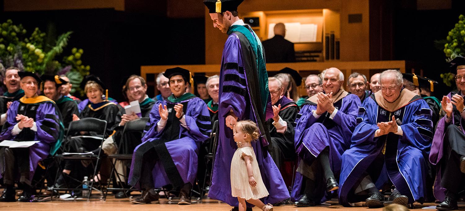 Graduates Walks Across Stage