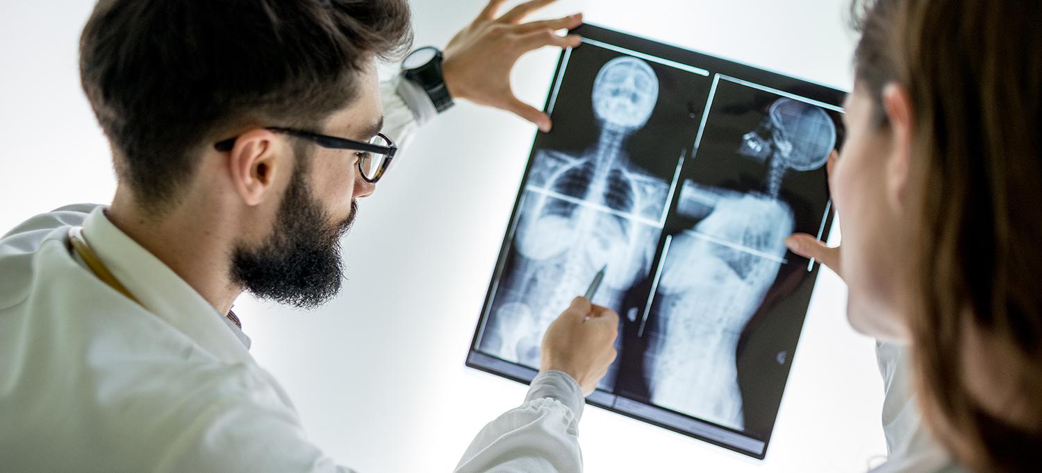 Doctor Studies an X-ray