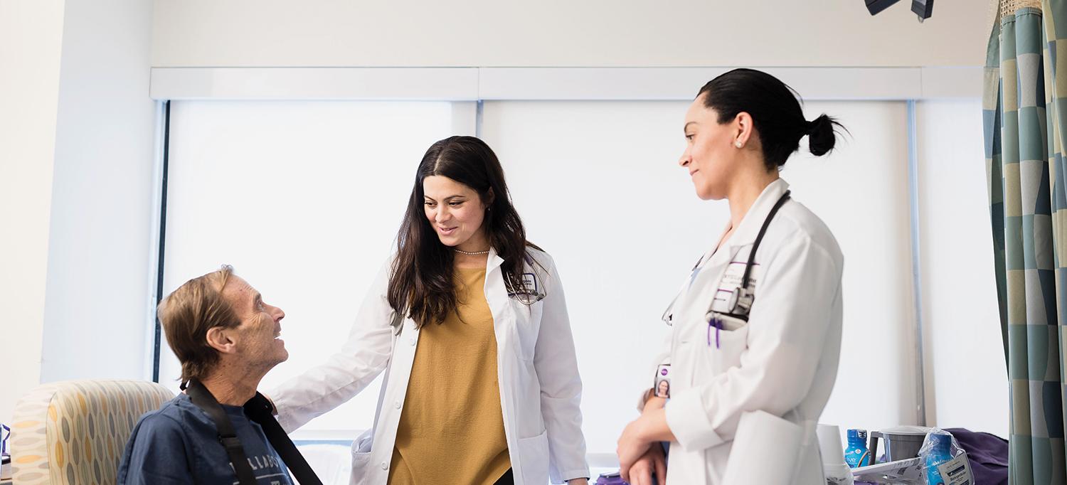 Sofiya Prilik, MD, and Francesca Toone, NP, Consult with a Patient