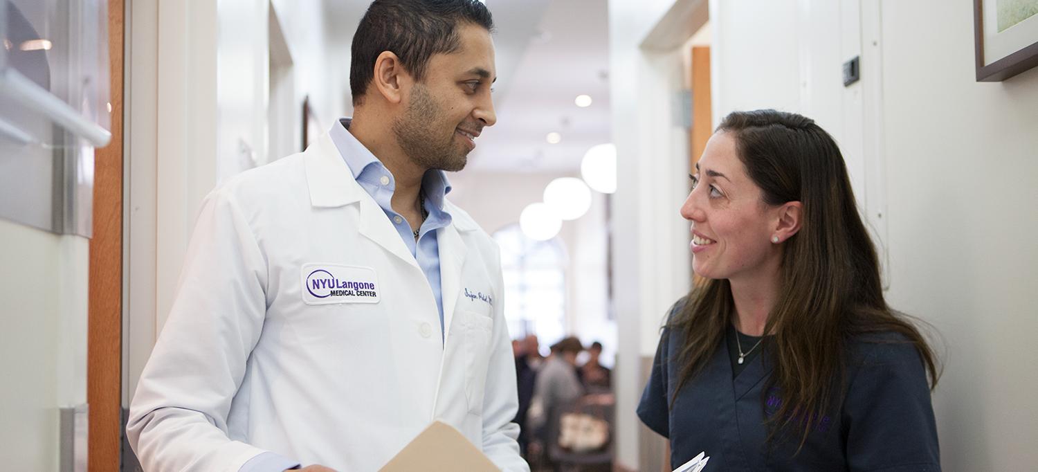 Dr. Sujan Patel Speaks with a Colleague