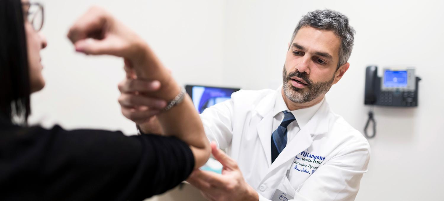 Dr. Jose Scher Examines Patient
