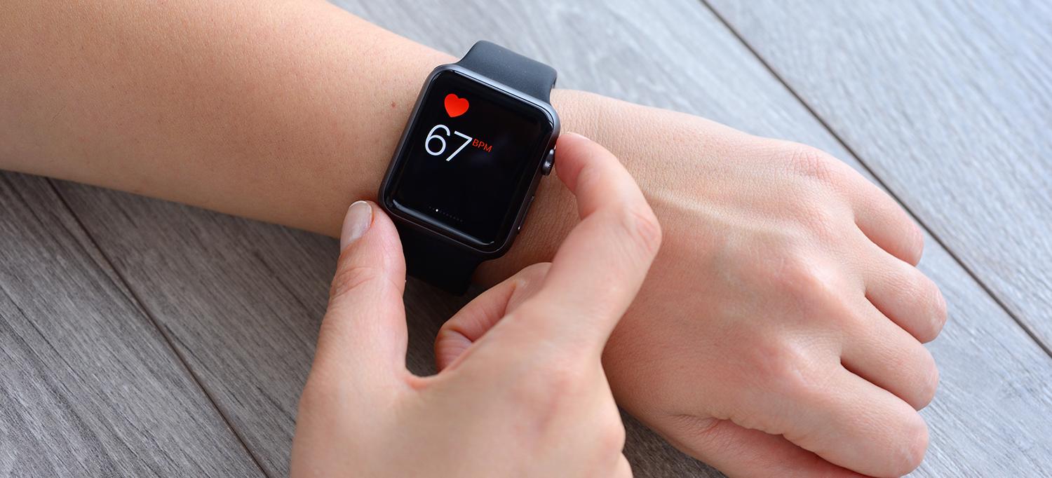 Person Checks Heart Rate on Smartwatch