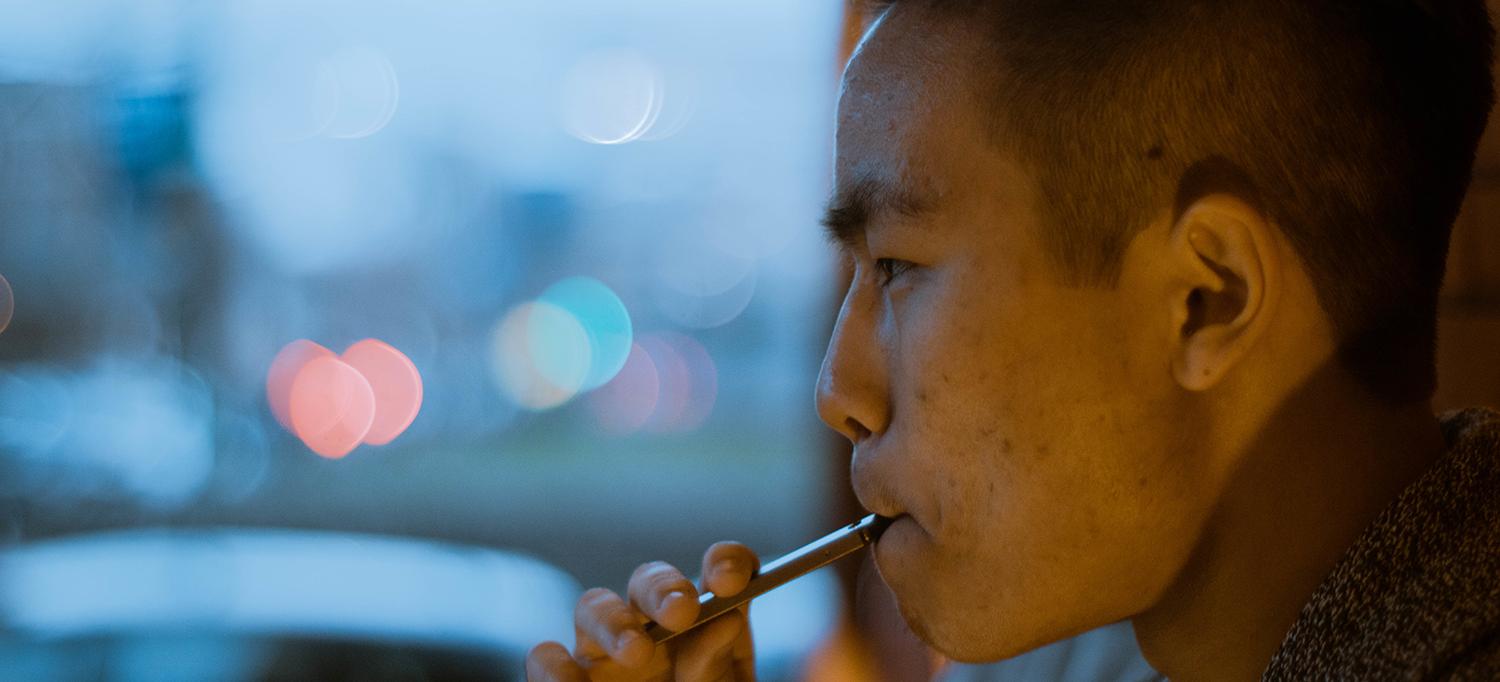 Man Smokes a Vape Pen