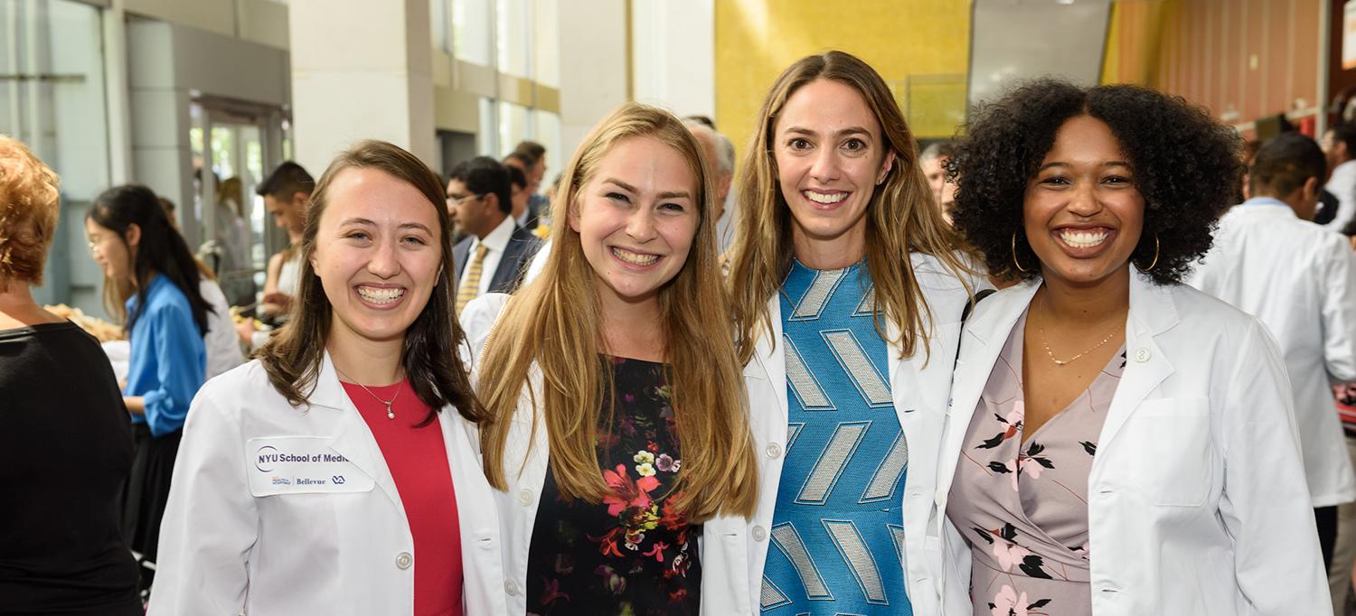 Four Medical Students in White Coats