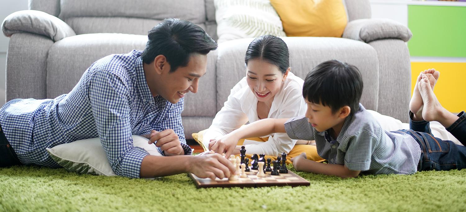 Family Playing Chess Together