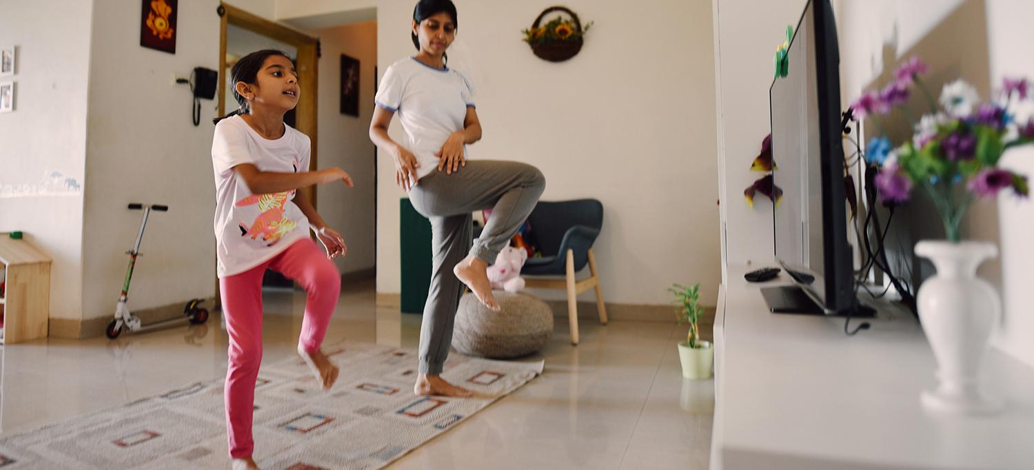 Kids Perform Exercises Along with Video on TV