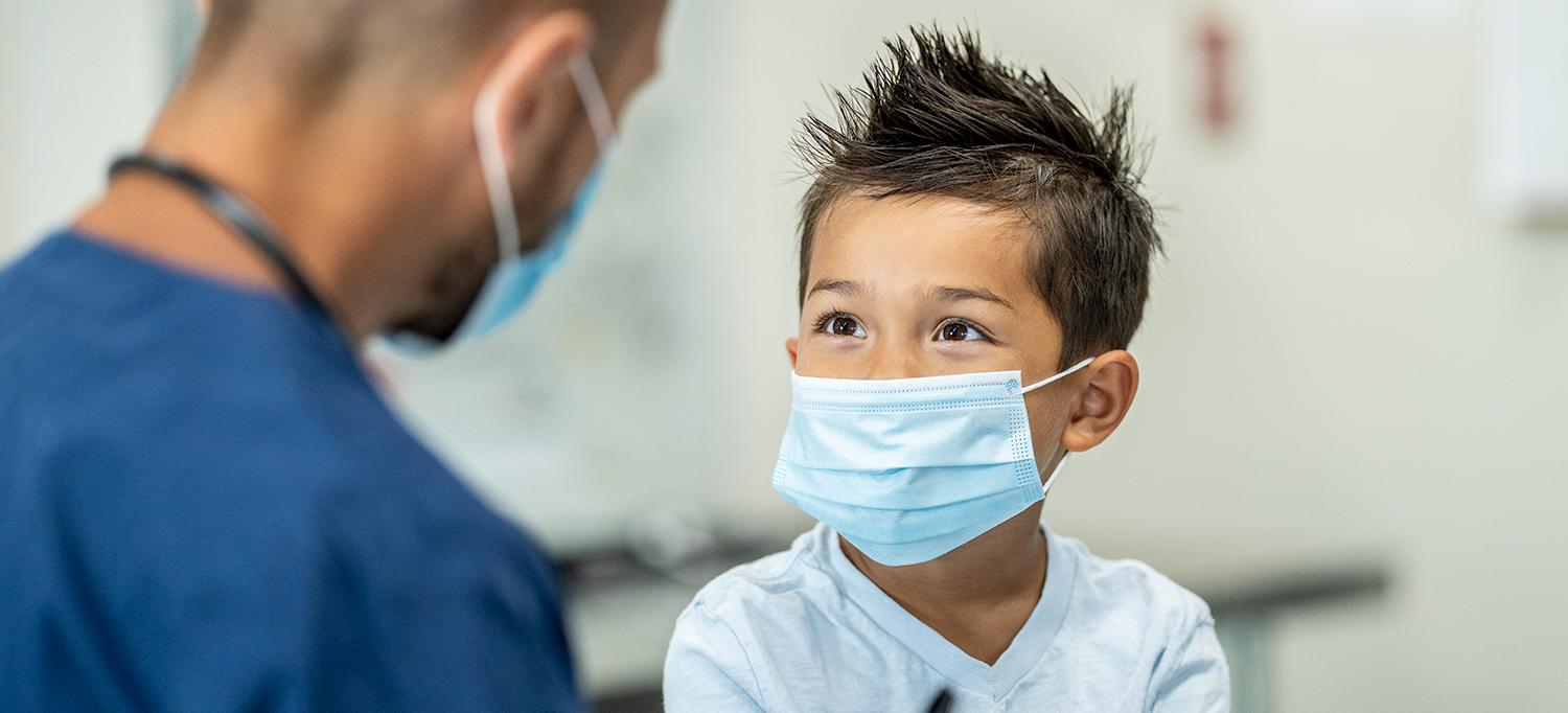 Child Wearing Mask Meets with Healthcare Provider in Mask