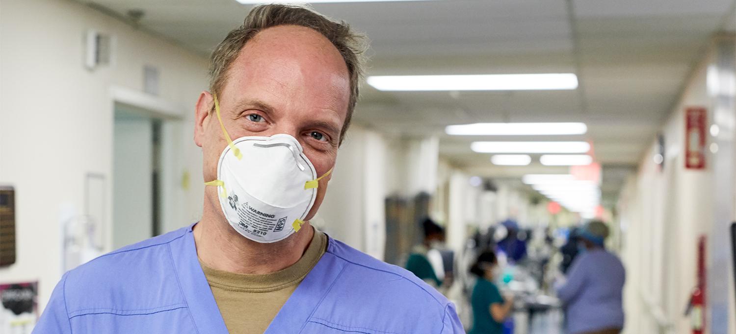 Dr. Michael S. Phillips Wearing Face Mask in Hospital Hallway