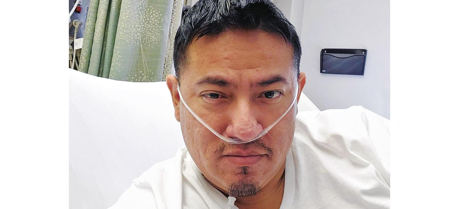 Patient Miguel Chamaldan in Hospital Bed with Nasal Cannula