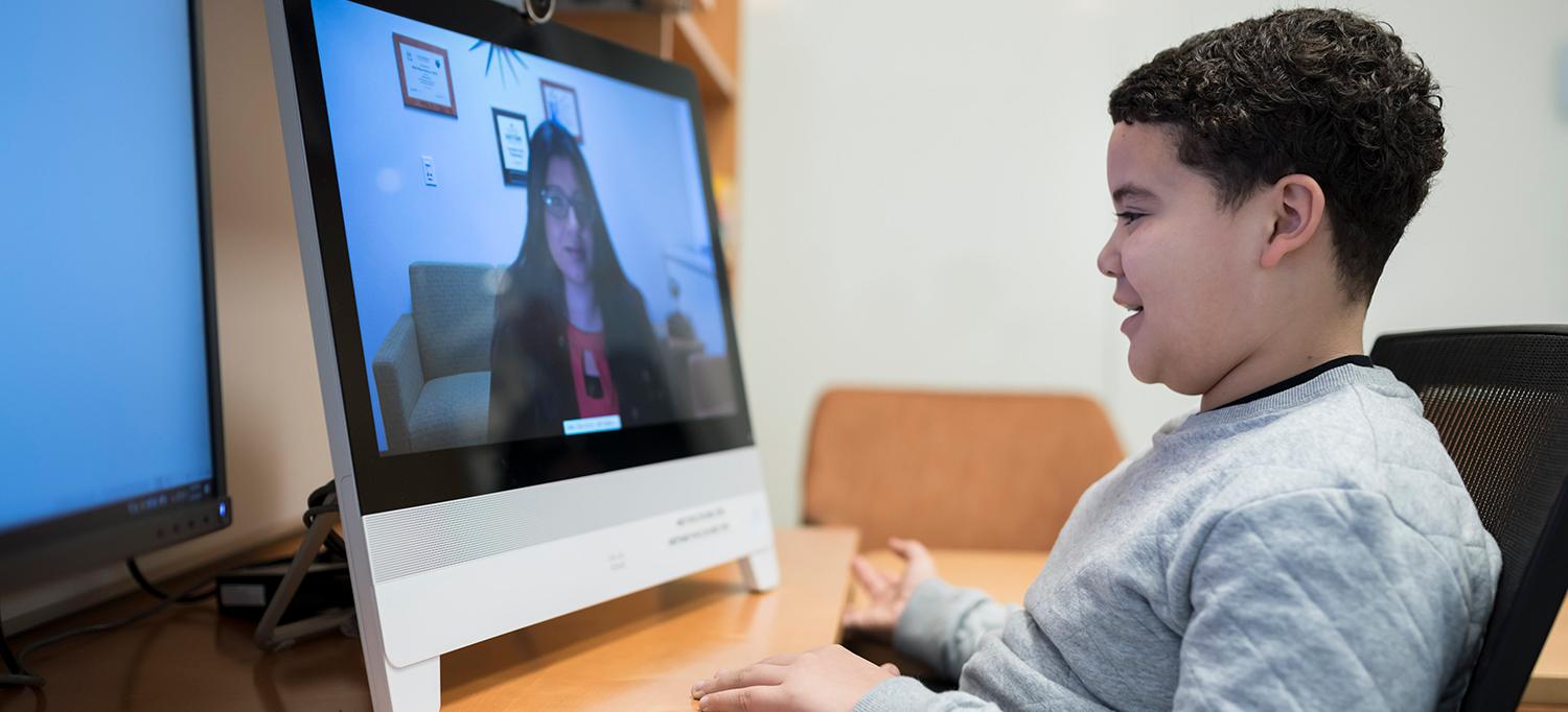 Young Patient Speaks with Dr. Shabana Khan Through His Computer