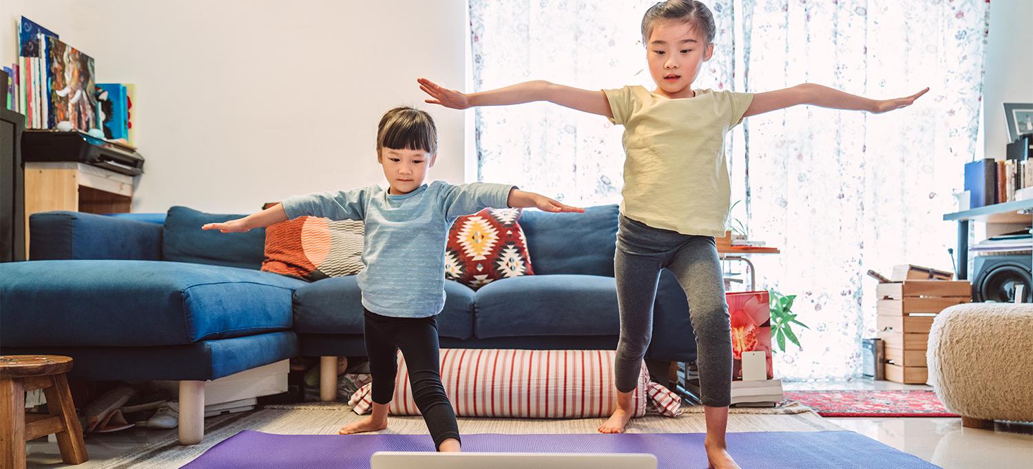 Two Kids Participating in Online Yoga Lessons