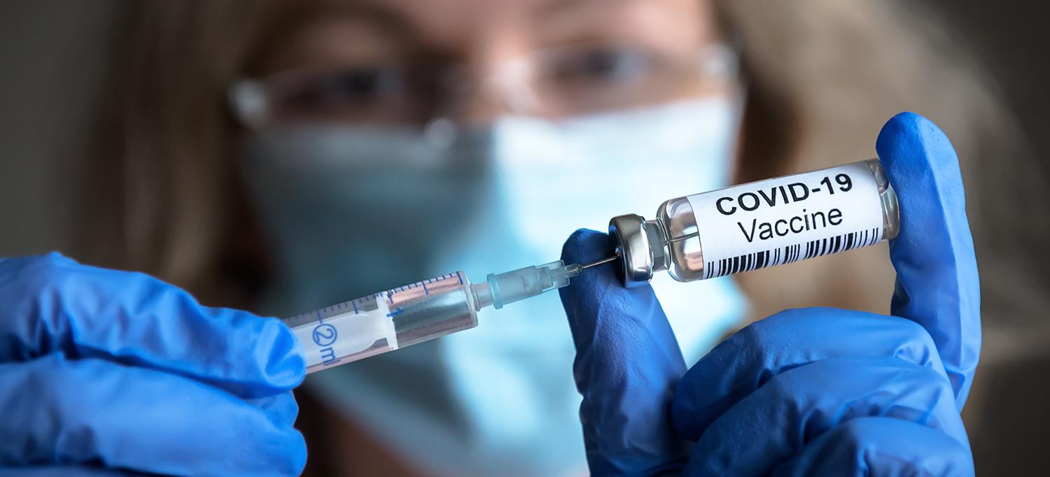 Healthcare Provider Drawing Dose of COVID-19 Vaccine