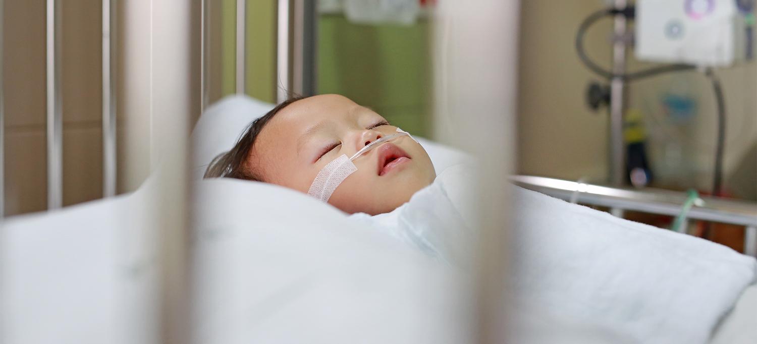 Baby in Hospital Bed with Nasal Cannula