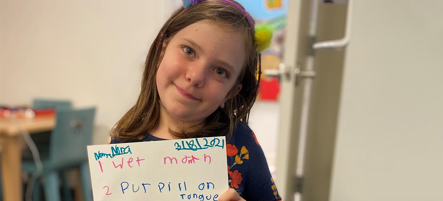 Nora Holds Handwritten Instructions on Taking Pills