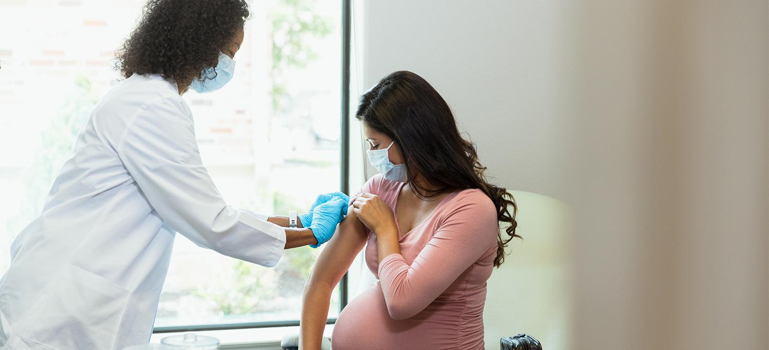 Pregnant Person Receives Vaccine Dose