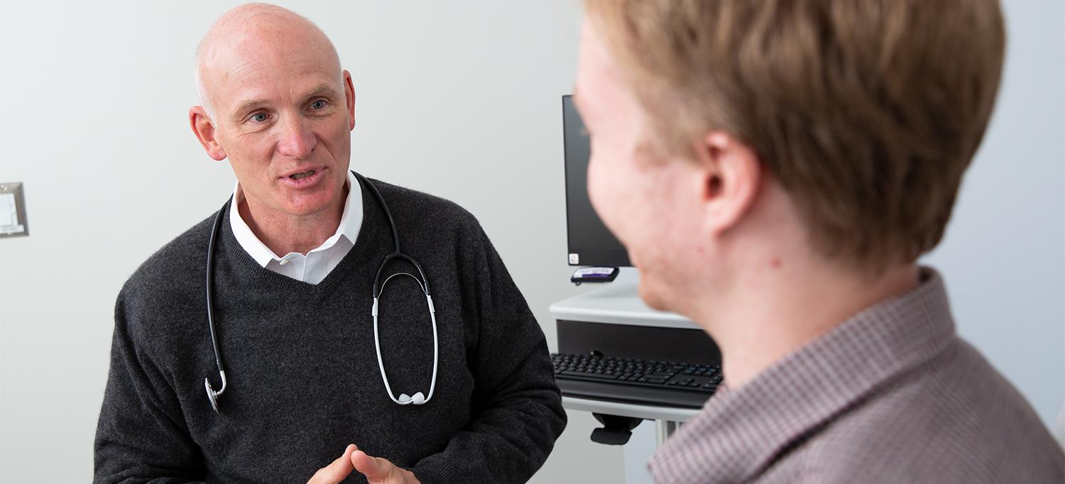 Doctor Discusses Treatment with Patient