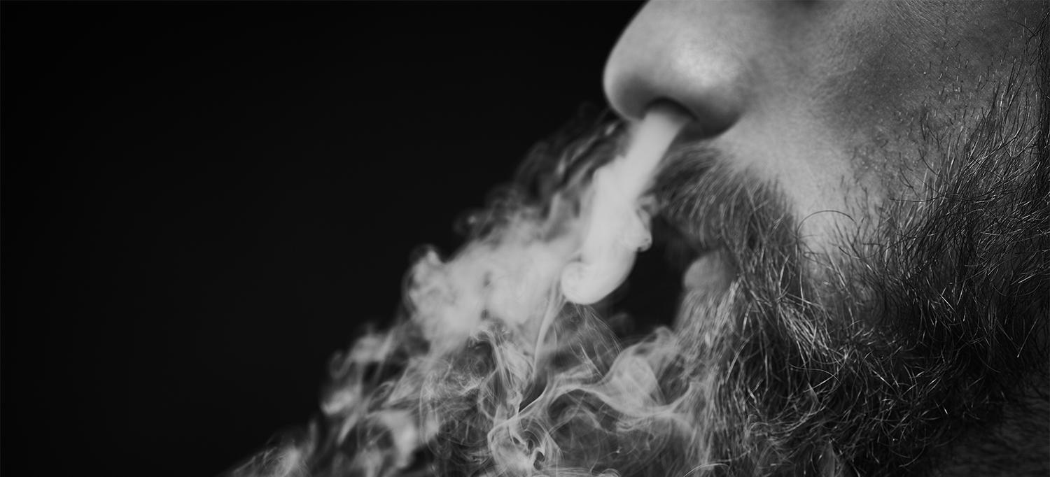 Person Exhaling Smoke Through Nose