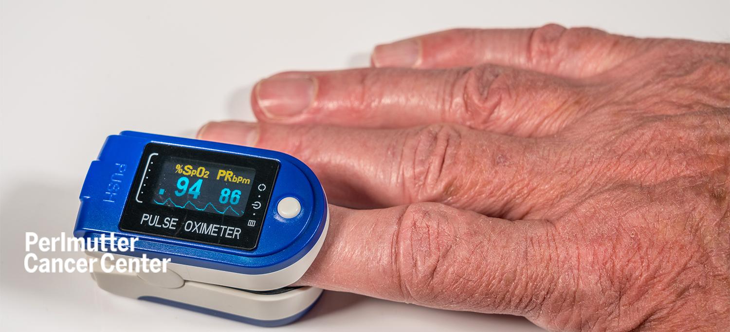 Hand with Pulse Oximeter on Forefinger