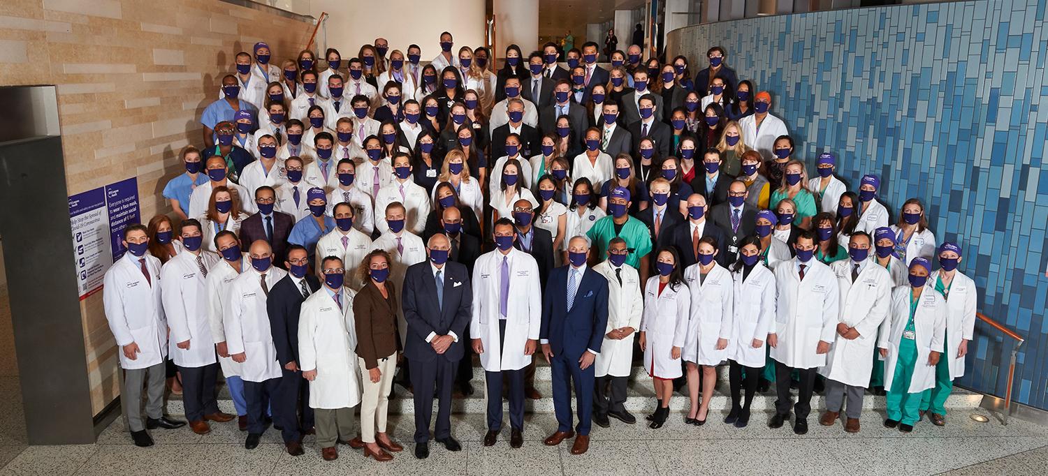 Transplant Team Wearing Face Masks in Hospital Entryway