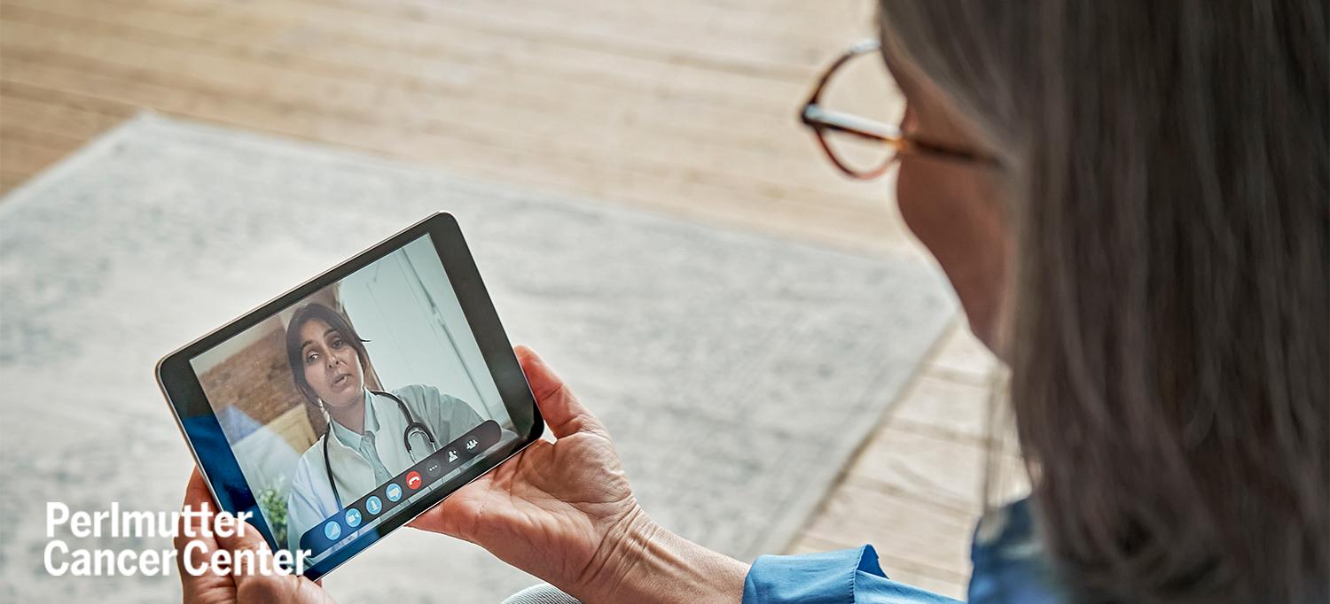 Person Having Video Appointment with Doctor on Tablet