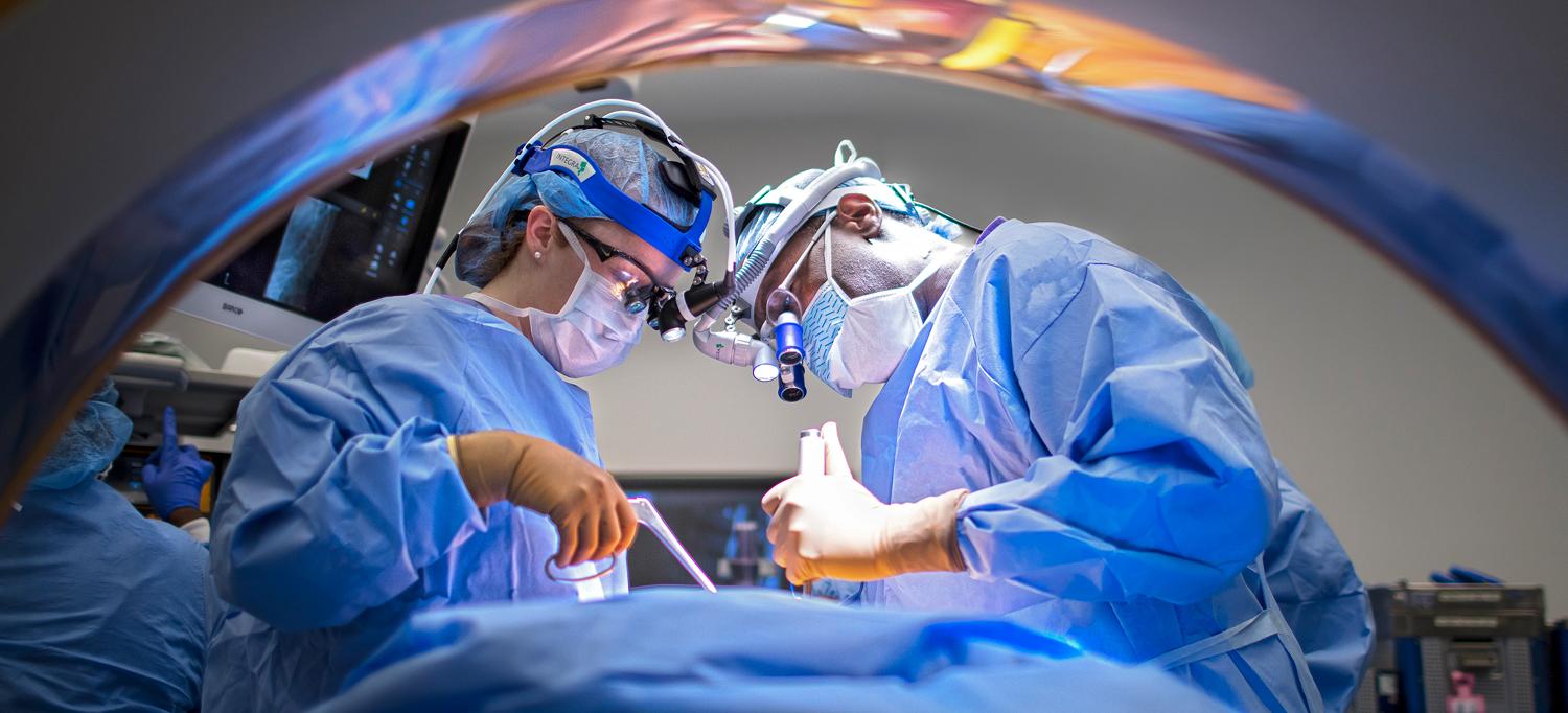 Surgeons Performing Procedure in Operating Room
