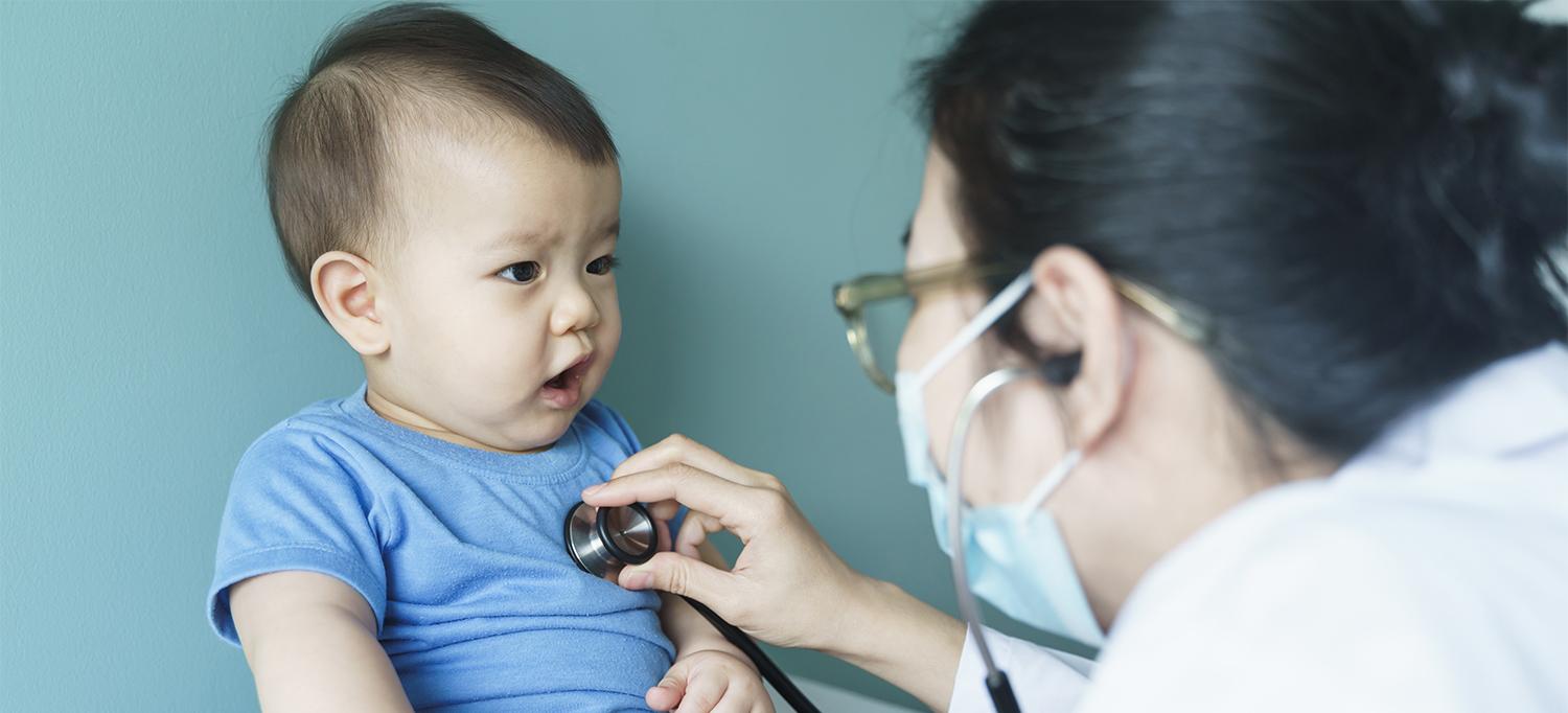 Doctor Listening to Baby’s Heartbeat with Stethoscope