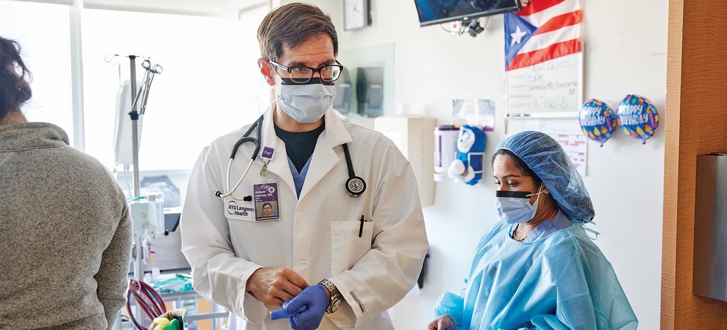 Dr. Anthony S. Lubinsky and Team Wearing Personal Protective Equipment in Patient’s Room