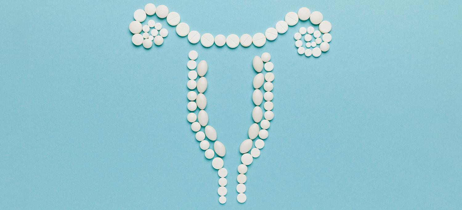 Pills Forming the Outline of the Female Reproductive System