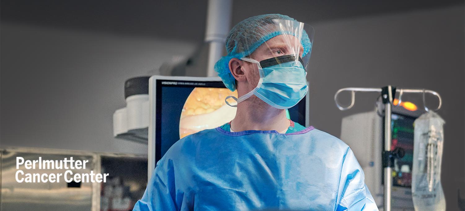 Dr. Anthony Corcoran Wearing Surgical Gown and Mask in Operating Room