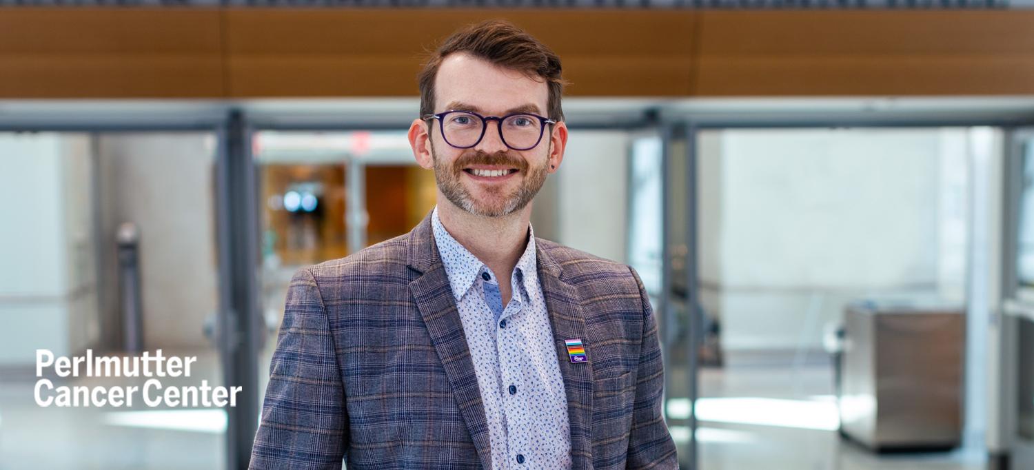 Dr. Jason Domogauer Wearing a Pride Flag Pin on Lapel