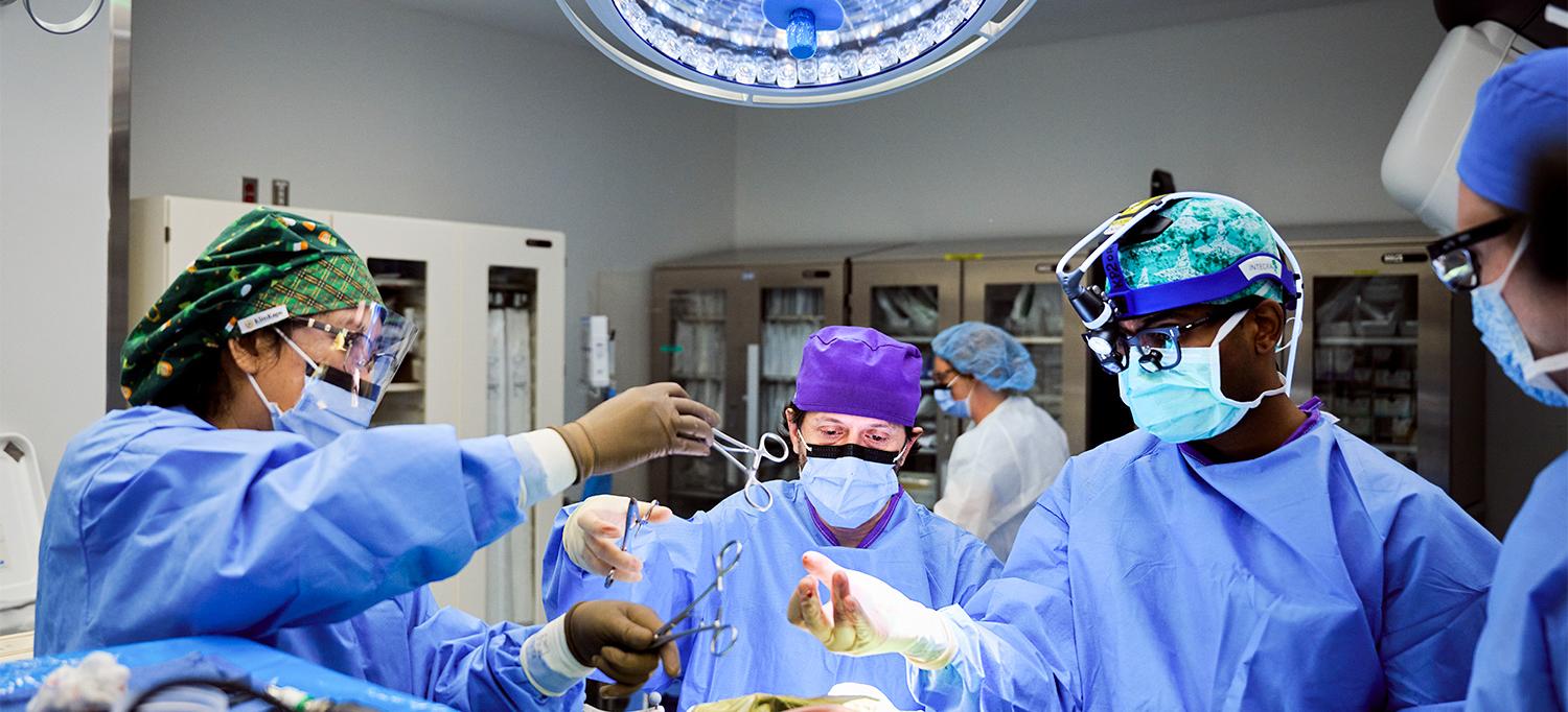 Dr. Erez Nossek and Team Performing Neurosurgical Procedure in Operating Room