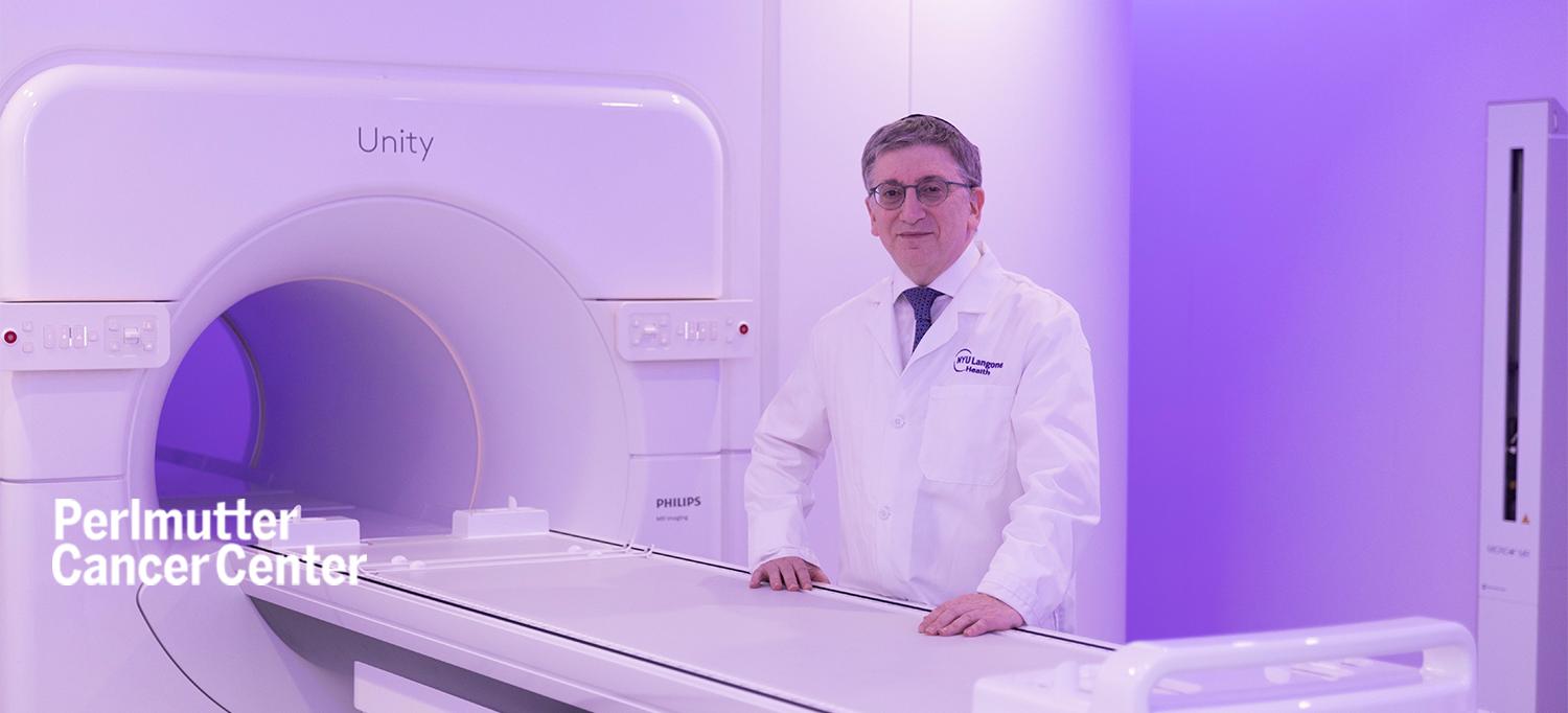 Dr. Michael J. Zelefsky standing next to an MRI-LINAC machine