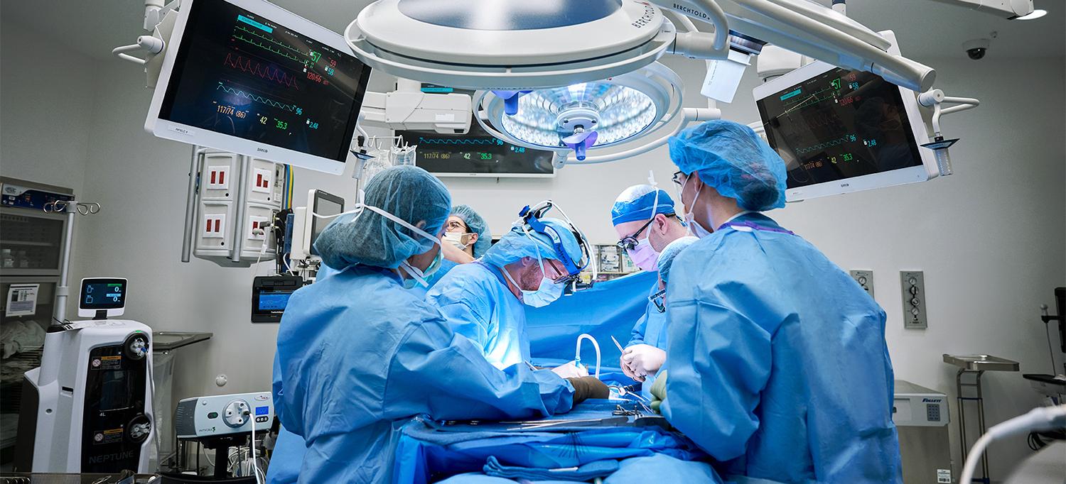 Dr. Robert Montgomery and team performing surgery in operating room