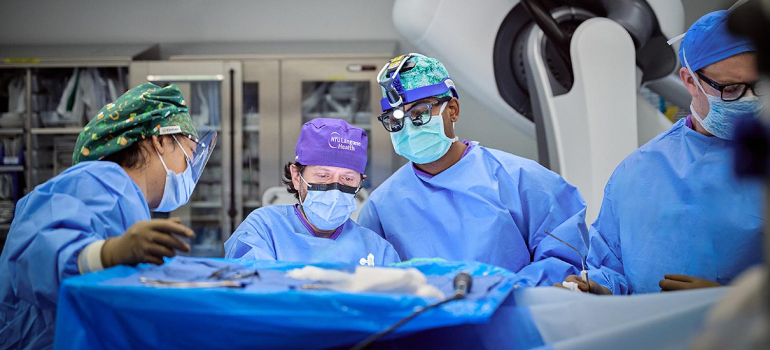 Dr. Erez Nossek and team performing surgery in operating room