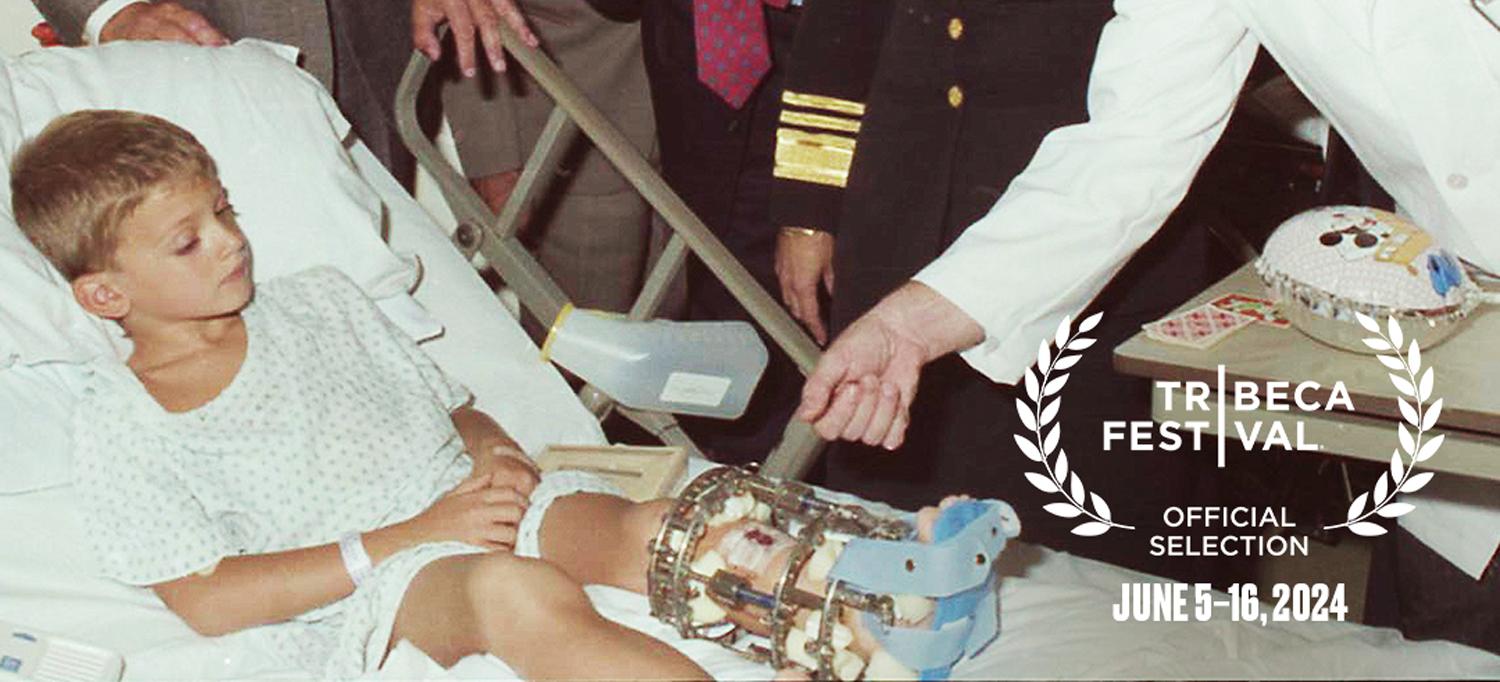 A still from the movie shows a boy in a brace being examined by a doctor. Writing to one side says Tribeca Festival, Official Selection, June 5 to 16, 2024.