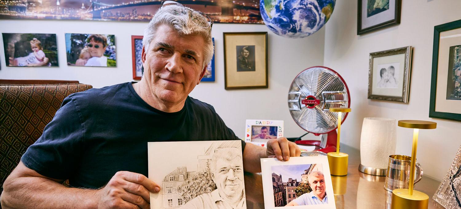 Benedict holds up a drawing and the photograph he based it on. 