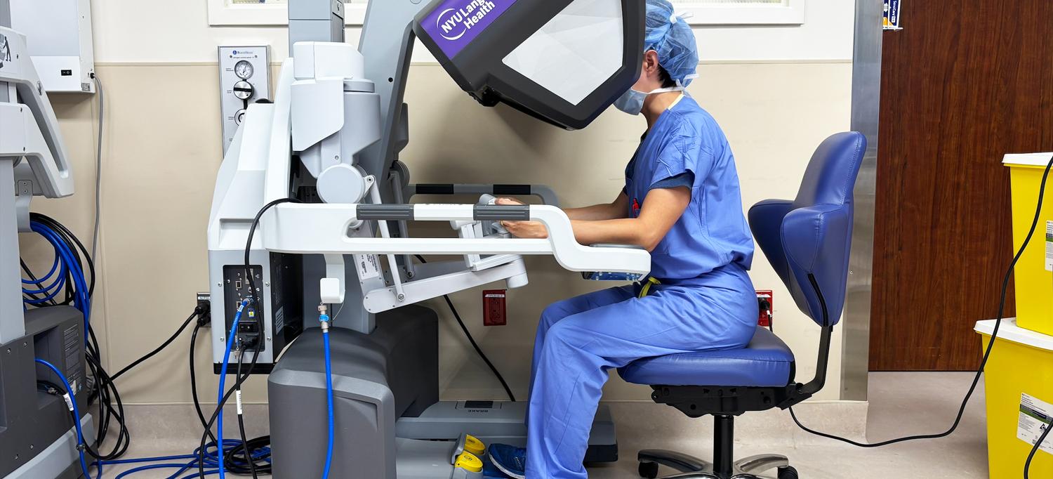 A surgeon uses a robotic machine to perform a surgical procedure. 