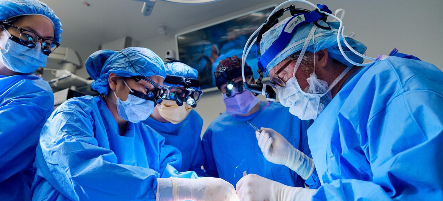 Surgeons and other working in an operating room