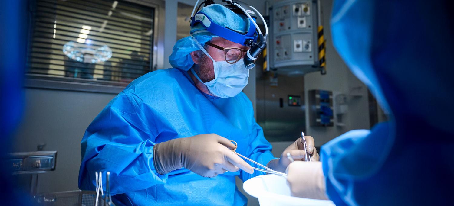Dr. Robert Montgomery performing an operation